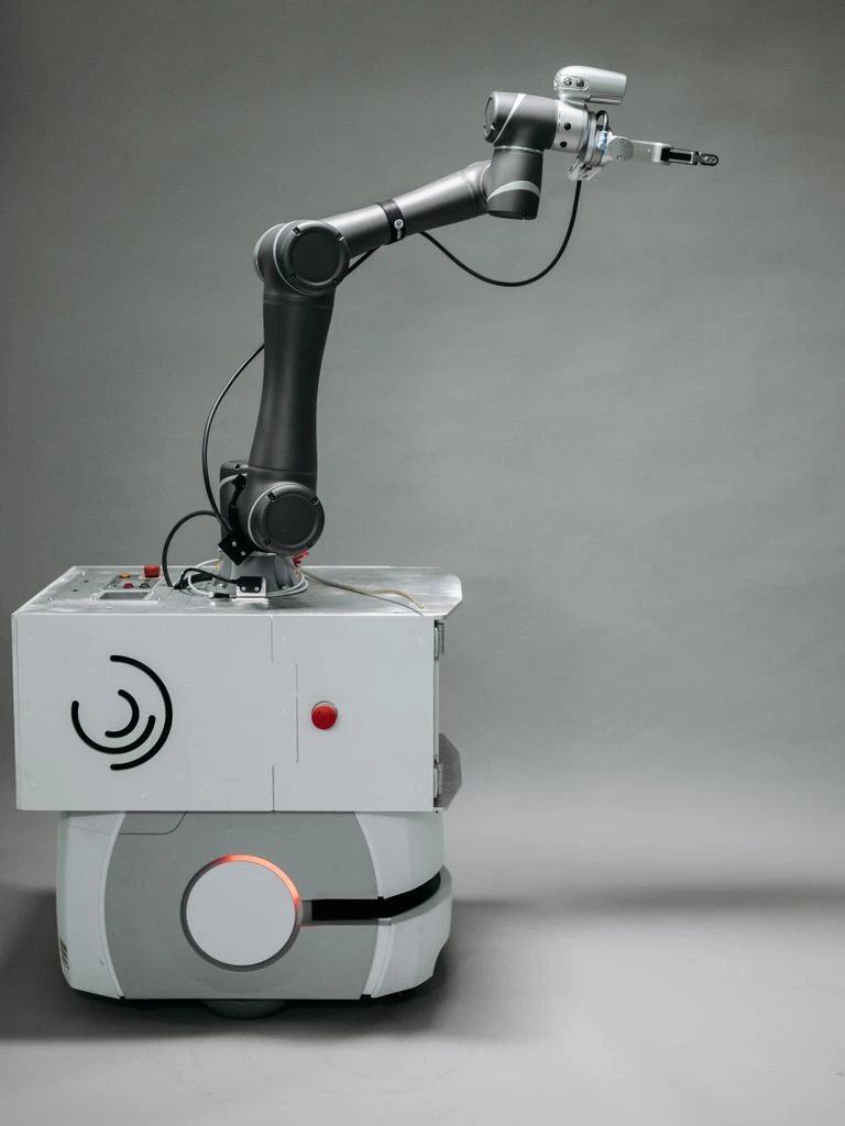 Robotic welding cell inside a body-in-white line.